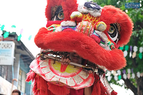 LOOK: Lion dancers are performing along a road in Paco, Manila, visiting houses and establishments, as part of the community's fiesta celebration on Sunday, 25 August 2024. 