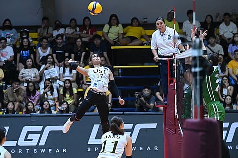 Angge Poyos rises to the occasion anew to power UST to a  25-16, 19-25, 14-25, 25-22, 15-12 win over CSB in the V-League Collegiate Challenge Sunday at the Paco Arena in Manila.