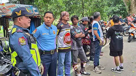 Police standing on the road discussing