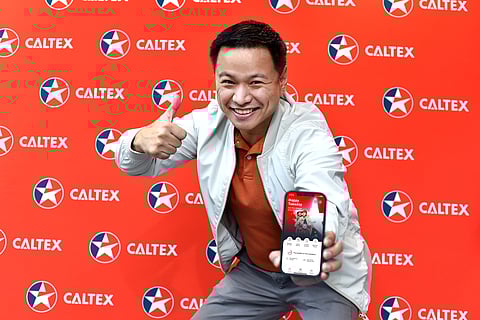 MARTI Gimenez, a resident of Parañaque, flexes his winnings of 12 million Caltex Rewards points on the CaltexGO app.