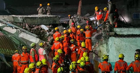 SDRF personnel conduct a rescue operation after a three-storey building collapsed at Transport Nagar area in Lucknow. 