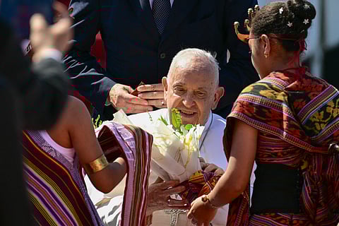 POPE Francis is greeted upon his arrival at Presidente Nicolau Lobato International Airport in Dili on 9 September. It will be the Pope’s third stop of an Asia-Pacific tour, the longest of the 87-year-old’s papacy.