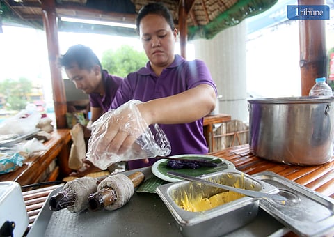LOOK: Vendors sell Bibingka (rice cake) and Puto Bumbong (purple rice cake steamed in bamboo tubes) at Masinag in Antipolo on 16 September 2024.