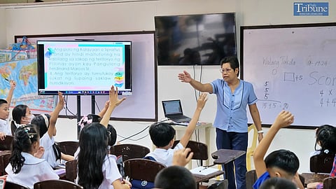 Teacher with pupils in classroom