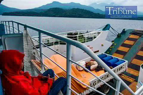 PHOTO: A crew member is sitting on his hammock as the ferry arrives at the Port of Benoni, which is located in the municipality of Mahinog on the island of Camiguin. The Port of Benoni serves as one of the main entry points for travelers coming from the mainland of Mindanao, especially from the Port of Balingoan. 
