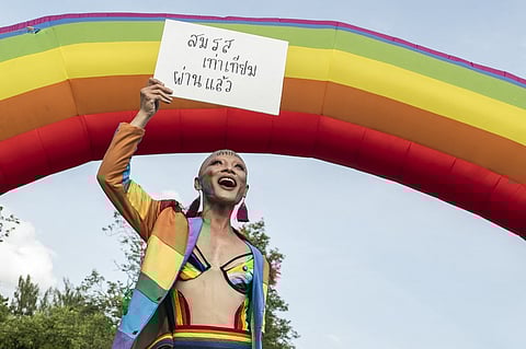 (FILES) A member of the LGBTQ community celebrates after the Thai parliament passed the final senatorial vote on the same sex marriage bill, at Government House in Bangkok on June 18, 2024. The Thai king has signed same-sex marriage into law, the official Royal Gazette announced on September 24, making Thailand the first country in Southeast Asia to recognise marriage equality.

