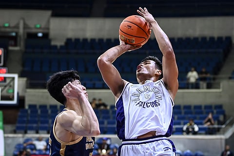 Joshua Yerro tips in the game-winning basket at the buzzer as Adamson defeats NU, 60-58, in the UAAP Season 87 men's basketball tournament. 