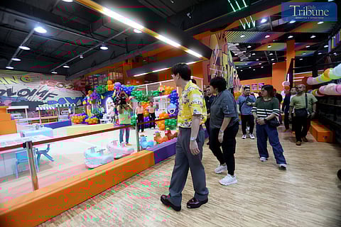 LOOK: Fantasy World opens its flagship store at SM Fairview in Quezon City on 27 September 2024 as the Philippines' largest indoor amusement park. Photos show SM Supermall president Steven Tan (in yellow shirt, middle), leading the stitching of the balloon and tour inside the store as well as other representatives during the opening. 