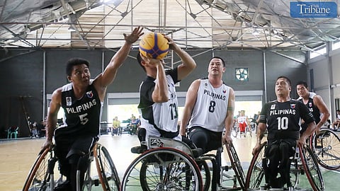 Basketball team playing on wheelchairs