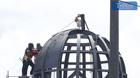 Workers are busy working atop the under-construction building of Kristong Hari Columbarium along Commonwealth Avenue in Quezon City on Thursday, 17 October 2024. Photos by ANALY LABOR