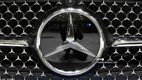 The Mercedes-Benz logo is displayed on the front of a Mercedes-Benz CLE Cabriolet passenger car at the Annual Results Conference of the Mercedes-Benz Group AG in Stuttgart, southern Germany on 22 February 2024.