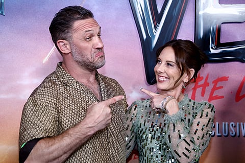 British actor Tom Hardy (L) and British filmmaker Kelly Marcel attend the world premiere of "Venom: The Last Dance" at the Regal Times Square in New York, 21 October, 2024.
