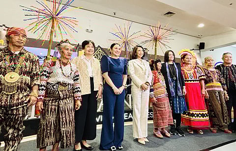 In the photo are: Department of Trade and Industry (DTI)-Bureau of Market Development, Promotions, and One Town, One Product (OTOP) Philippines Director Marievic Bonoan, Secretary Cristina Roque, and Department of Tourism Secretary Christina Garcia Frasco, with indigenous peoples at the launch of the National Arts and Crafts Fair 2024 at the SM Megamall Megatrade Hall.
