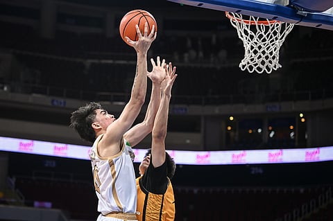 Jolo Manansala stars in NU's 67-62 comeback win over UST in the UAAP Season 87 men's basketball tournament.