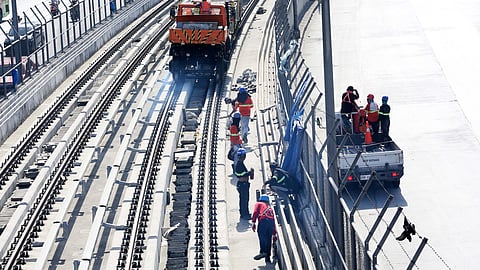 Workers are seen unloading materials for the ongoing Metro Rail Transit (MRT-7) construction project at Litex, Brgy. Commonwealth, in Quezon City, on Sunday, 10 November 2024. The 23-kilometer elevated railway line, with 14 stations from San Jose Del Monte, Bulacan, to MRT-3 North Avenue in Quezon City, is now 71.32 percent complete.