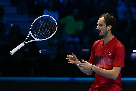 DANIIL Medvedev tosses his racket after bowing to Fritz Taylor in the opening round of the ATP Finals.   