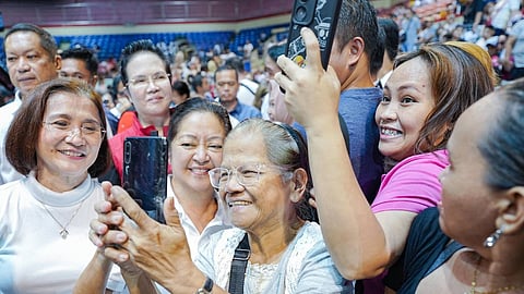 FIrst Lady Liza Araneta-Marcos and Pasay City Mayor Emi Calixto Rubiano (left) share a light moment with residents at the ‘Lab for All: Laboratoryo, Konsulta at Gamot para sa Lahat’ at the Cuneta Astrodome on Thursday.