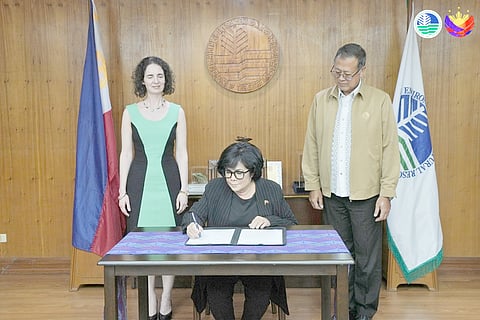 Department of Environment and Natural Resources Secretary Maria Antonia Yulo-Loyzaga signs the Joint Declaration on Cooperation in Addressing Climate Change with New Zealand Ambassador Dr. Catherine Rosemary McIntosh and DENR Undersecretary Jonas R. Leones as witnesses, in Quezon City.