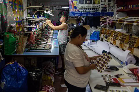 Workers at a logo and embroidery service are busy with their craft in Divisoria, Manila, on Tuesday, 26 November 2024.

Vietnam Rose, 24, shared that she has been working at the business for six years, starting when she was just 18. Similarly, Mannylyn, 34, who chose not to disclose her last name, said she has also been employed there for about six years.

The business specializes in embroidering logos for both government offices and private institutions. They also offer printing services. The establishment has been operating for 25 years, serving as a fixture in the bustling Divisoria district.
