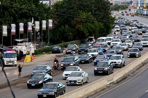 People drive on the highway between Sidon and Tyre on 27 November, 2024, as displaced people make their way back to their homes in the south of Lebanon after a ceasefire between Israel and Hezbollah took effect.
