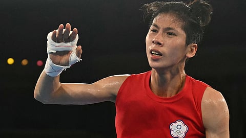 (FILES) Taiwan's Lin Yu-ting reacts after beating Poland's Julia Szeremeta (Blue) in the women's 57kg final boxing match during the Paris 2024 Olympic Games at the Roland-Garros Stadium, in Paris on 10 August 2024. Taiwan's Olympic boxing gold medallist Lin Yu-ting has pulled out of an international competition in Britain after the organiser questioned her gender eligibility, Taiwanese sports officials said on 27 November.