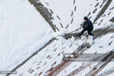 LOOK: A worker clears snow in Seoul on 28 November 2024, as heavy snowfall blanketed South Korea for a second consecutive day, resulting in three deaths overall and disrupting flights and ferry services, authorities said.