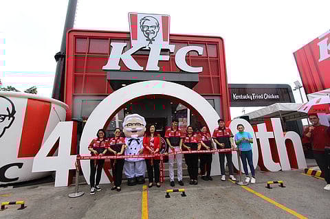 Officials of KFC Philippines unveil its 400th store and 100th branch that has drive-thru service on Friday, situated on Highway 2000, Taytay, Rizal. 