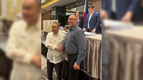 Abraham ‘Bambol’ Tolentino (left) shakes the hand of Joaquin ‘Chito’ Loyzaga as a symbol of sportsmanship after beating him by a wide margin for the presidency of the Philippine Olympic Committee during the election of officers last Friday.