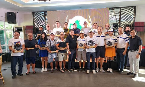 Winners of the 2nd Santiago Cua Cup tournament pose for a commemorative photo during the awarding ceremonies at the South Pacific Golf Club Davao.