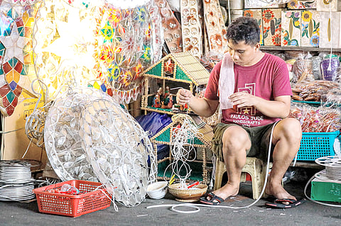 Christmas lantern makers in Quiapo, Manila are busy assembling vibrant decorations as the holiday season approaches. 