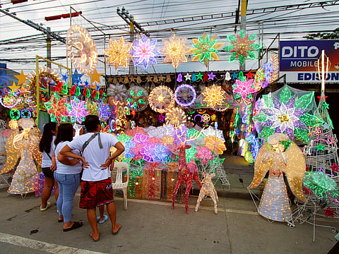 The Christmas lantern stalls light up the Jose Abad Santos Avenue of the City of San Fernando, Pampanga, indicating the bustling business of parol making in the province. 