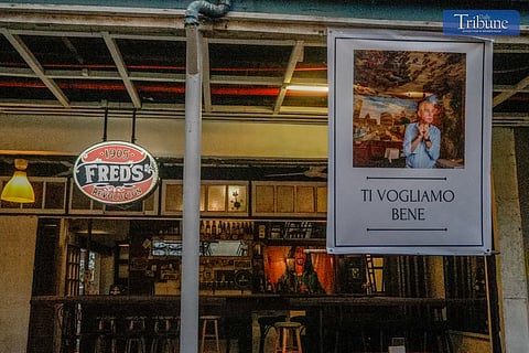 
A photojournalist pays tribute to a fellow photographer. 

Fred’s Revolucion, a staple bar in Cubao Expo, honors Roberto Bellini, owner of neighboring restaurant Bellini’s, with an image of him outside their facade. Bellini’s, an Italian restaurant in Quezon City's pub area, gained fame through the movie One More Chance. Roberto Bellini, who passed away at 84, was a photographer before starting his business in Cubao. Fred’s owner, Jose Soriano, is a retired photojournalist.