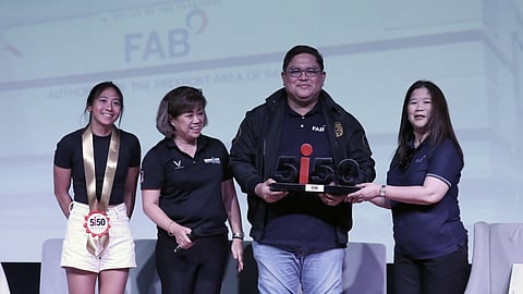 Freeport Area of Bataan CEO and Administrator Hussein Pangandaman (second from right) holds the 5150 FAB Triathlon Commemorative M Dot Symbol during the official launch of the event in Mariveles on Saturday. Joining him are (from left) top triathlete Kim Mangrobang, Sunrise Events Inc. president Princess Galura, representing The IRONMAN Group, and Malou Herrera, FAB Deputy Administrator for Support Services.