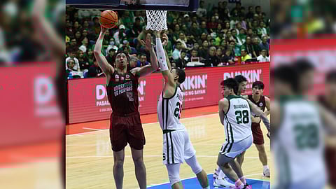 Quentin Millora-Brown powers the UP Fighting Maroons to a rousing 73-65 victory over defending champion La Salle in Game 1 of their UAAP Season 87 best-of-three finals Sunday at the Smart Araneta Coliseum.