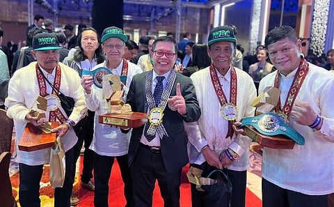 In the eyes of the WBC,(Middle) Filipino boxing  judge Rey Danseco is truly one of a kind. 