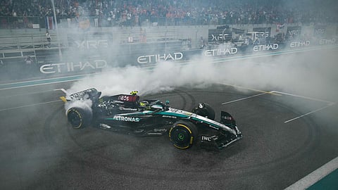 Final twist: Lewis Hamilton does a donut at the end of his last Mercedes rive at the Abu Dhabi Grand Prix 