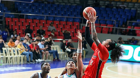 Joshua Munzon delivers the crucial blows to help NorthPort pull of a 108-101 win over Converge in the PBA Commissioner’s Cup last night.