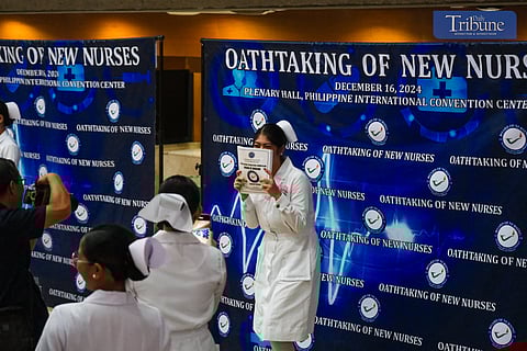 Newly registered nurses line up as they enter the venue for their oath-taking ceremony on 16 December, 2024, at the Plenary Hall of the Philippine International Convention Center (PICC), CCP Complex, Roxas Boulevard, Pasay City. The Professional Regulation Commission (PRC) announced on 28 November that 29,349 out of 34,534 examinees passed the November 2024 Philippine Nurses Licensure Examination.