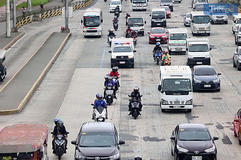 (December 17, 2024) On Tuesday, December 17, 2024, motorcycle taxis were seen plying Commonwealth Avenue in Quezon City. The Land Transportation Franchising and Regulatory Board (LTFRB) has issued a show cause order (SCO) to two of the three ride-hailing companies operating in the national capital for allegedly exceeding the government's limit on the number of motorcycle taxi riders. Photo/