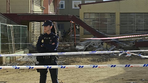 A police officer stands in front of Luis Vives college of Massanassa, south of Valencia, on November 24, 2024