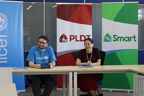 United Nations Children’s Fund Deputy Country Representative for Operations to the Philippines Edgar Donoso (left) and PLDT and Smart FVP and chief sustainability officer Melissa Vergel de Dios celebrate an expanded collaboration in promoting child rights and sustainability in the tech sector.
