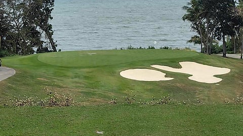 The iconic par-3 11th hole at the Zamora Championship Course in Ternate, Cavite, stands as one of the most coveted and thrilling challenges in the country, where every shot holds the promise of both glory and peril.