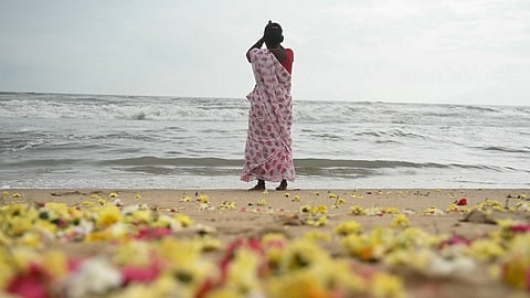 Flowers are scattered on the beach after women performed rituals during a ceremony held for the victims of the 2004 Indian Ocean tsunami, at Pattinapakkam beach in Chennai on 26 December 2024. On 26 December 2004, a magnitude 9.1 earthquake struck the coast of Sumatra in Indonesia and triggered a huge tsunami across the Indian Ocean that killed more than 220,000 people in a dozen countries.