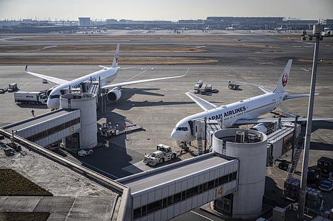 Japan Airlines passenger planes are seen on the tarmac at Haneda Airport in Tokyo on 26 December 2024. Japan Airlines reported a cyberattack that caused delays to domestic and international flights but later said it had found and addressed the cause.