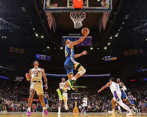 SAN FRANCISCO, CA - DECEMBER 25: Stephen Curry #30 of the Golden State Warriors drives to the basket during the game against the Los Angeles Lakers on December 25, 2024 at Chase Center in San Francisco, California