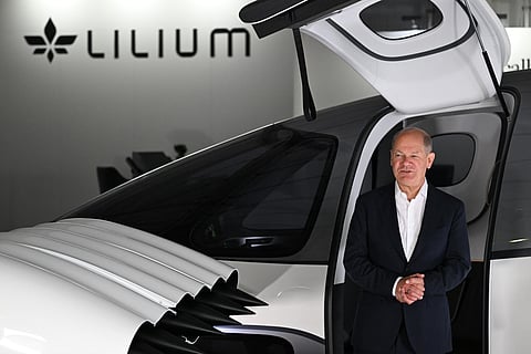 German Chancellor Olaf Scholz with a Lilium jet at an aerospace exhibition 