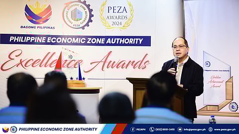 PEZA director general Tereso Panga addresses the awardees of various commendations as they cap the year extolling outstanding PEZA locators recently. 