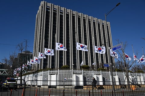South Korean national flags flutter at half-mast at the Government Complex in Seoul on 31 December, 2024, after the Jeju Air plane crash. The Boeing 737-800 was carrying 181 people from Thailand to South Korea when it crashed on arrival on 29 December, killing everyone aboard — save two flight attendants pulled from the twisted wreckage of the worst aviation disaster on South Korean soil.
