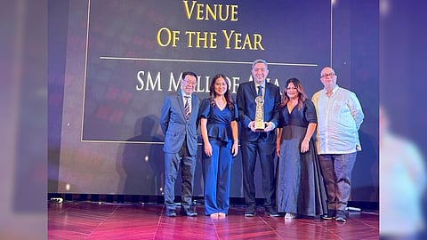 SM Mall of Asia Arena’s senior assistant vice president and general manager Arnel Gonzales (center) accepts the ‘Sports Venue of the Year’ award at the 6th Philippine Sports Tourism Awards, reflecting SM MOA Arena’s role as the Philippines’ premier sports venue.