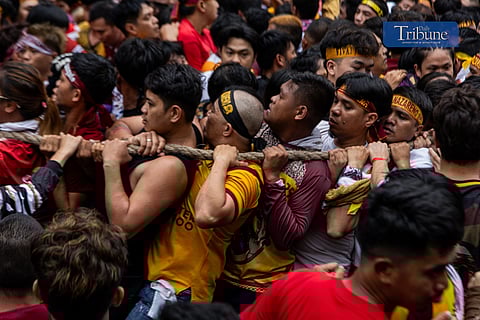 Chaotic scenes as Catholic devotees follow the andas of the Black Nazarene along Arlegui Street en route to Fraternal Street in Quiapo, Manila, on Thursday, 9 January 2025, during the annual Traslacion.